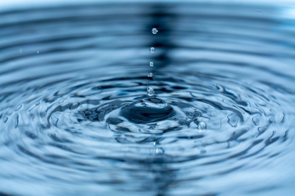 A mesmerizing close-up of water droplets and ripples, capturing dynamic motion and beauty.